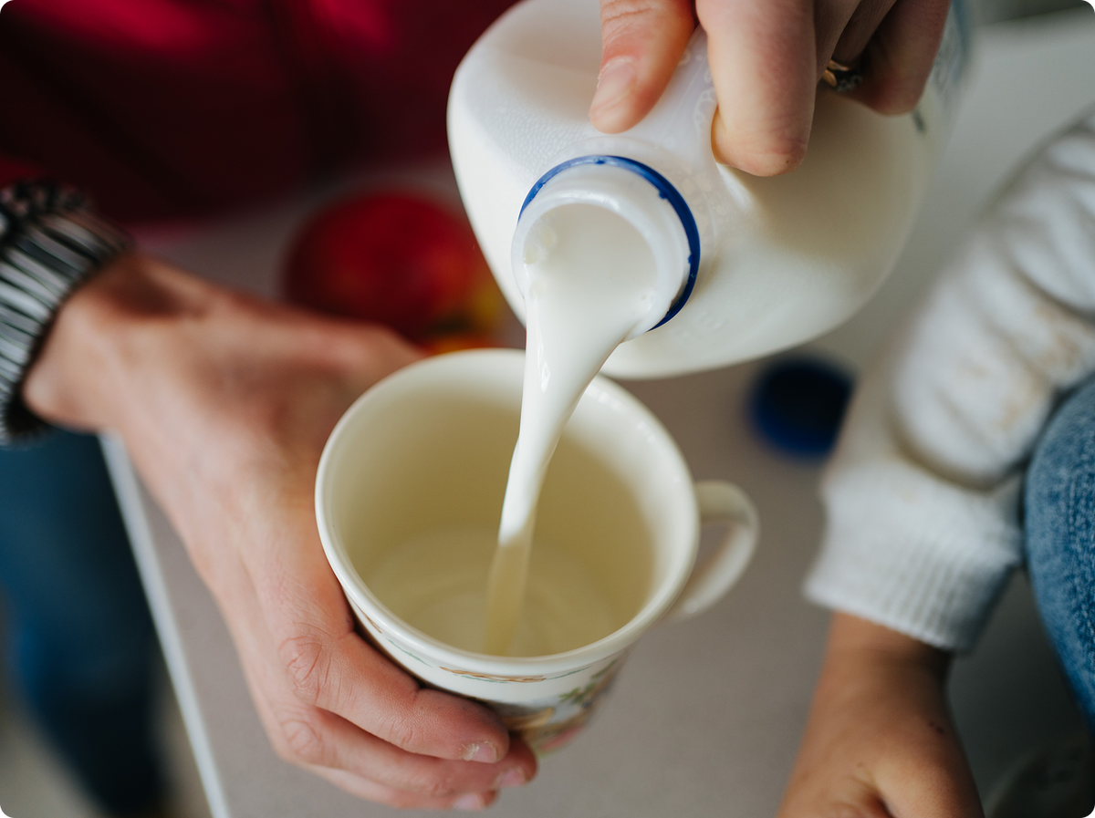 Person pouring Little Big Dairy milk